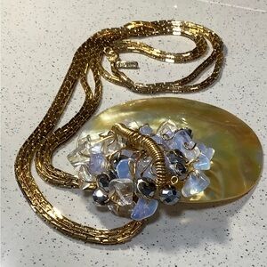 Monet gold necklace featuring a polished mother of pearl beaded pendant